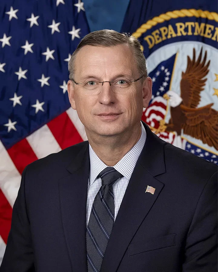 Headshot or formal portrait of Doug Collins