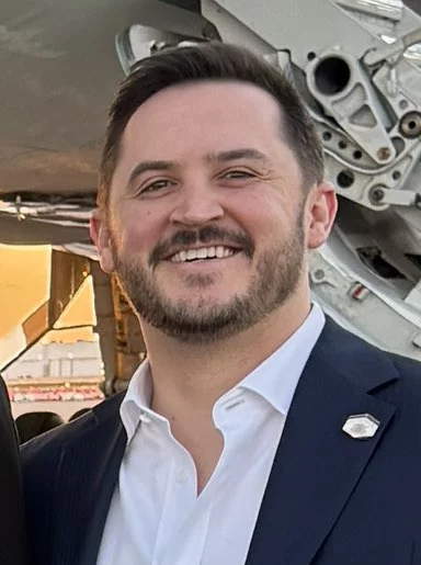 Headshot or formal portrait of Taylor Budowich